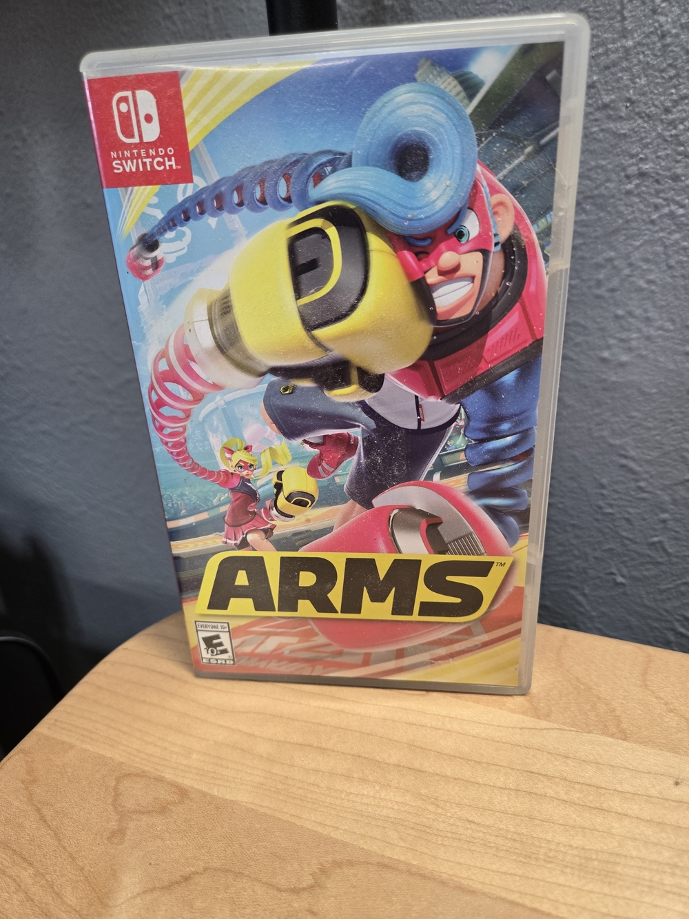 Nintendo ARMS Switch Game – Yellow, Blue & Pink Cover
